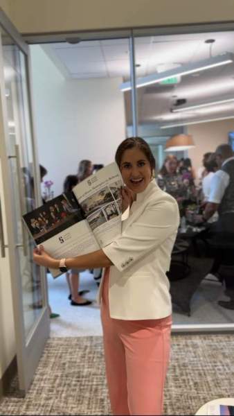 Annaliz Bosquez showing Jason Glast Group's Luxury Home Magazine Spread
